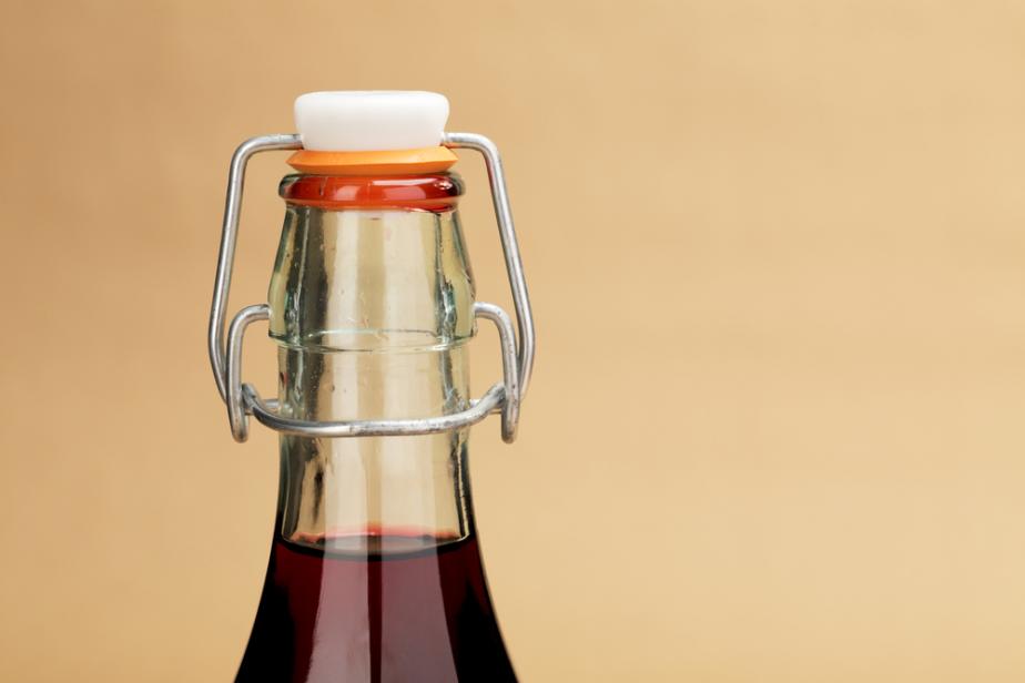 A close-up picture of a home made red wine in a classic bottle